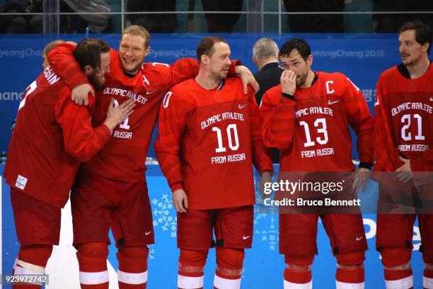 Gold medal winners Ivan Telegin, Sergei Andronov, Sergei Mozyakin, Pavel Datsyuk and Sergei Kalinin of Olympic Athlete from Russia celebrate during...