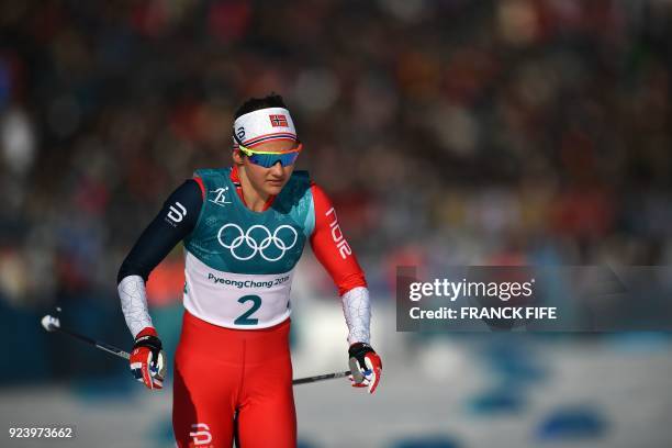 Norway's Ingvild Flugstad Oestberg competes during the women's 30km cross country mass start classic at the Alpensia cross country ski centre during...