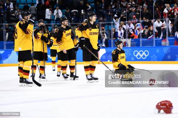 Germany's players react after losing the men's gold medal ice hockey match between the Olympic Athletes from Russia and Germany during the...