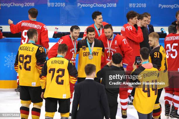 Silver medal winner Yasin Ehliz of Germany poses with gold medal winners Pavel Datsyuk and Ilya Kovalchuk of Olympic Athlete from Russia after the...