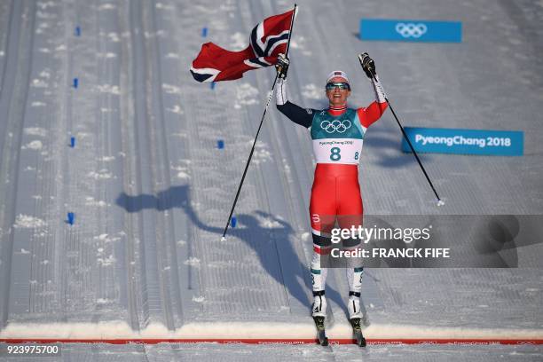 Norway's Marit Bjoergen wins the women's 30km cross country mass start classic at the Alpensia cross country ski centre during the Pyeongchang 2018...