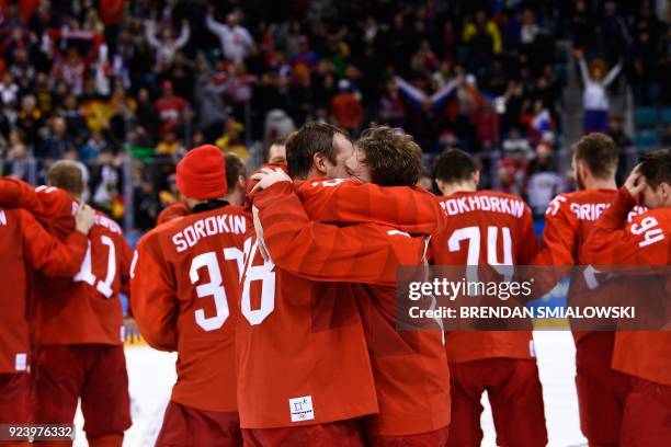 The Olympic Athletes from Russia's players celebrate winning the men's gold medal ice hockey match between the Olympic Athletes from Russia and...