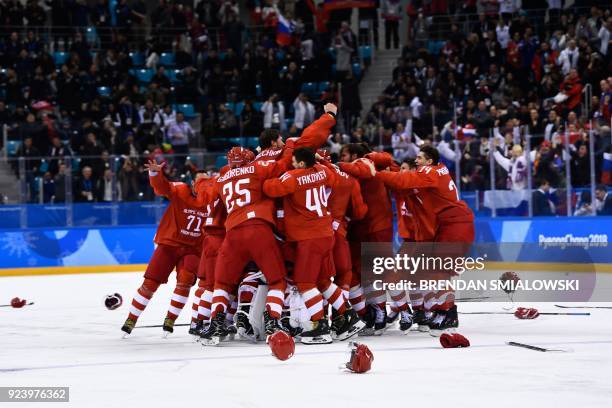 The Olympic Athletes from Russia's players celebrate winning the men's gold medal ice hockey match between the Olympic Athletes from Russia and...