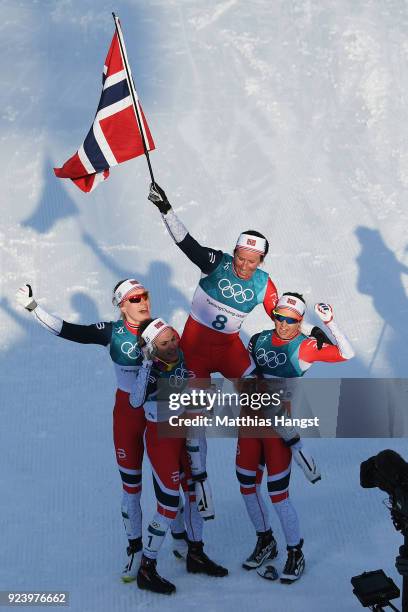 Marit Bjoergen of Norway celebrates winning the Ladies' 30km Mass Start Classic on day sixteen of the PyeongChang 2018 Winter Olympic Games at...