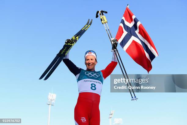 Marit Bjoergen of Norway celebrates winning the Ladies' 30km Mass Start Classic on day sixteen of the PyeongChang 2018 Winter Olympic Games at...