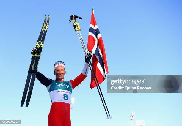 Marit Bjoergen of Norway celebrates winning the Ladies' 30km Mass Start Classic on day sixteen of the PyeongChang 2018 Winter Olympic Games at...