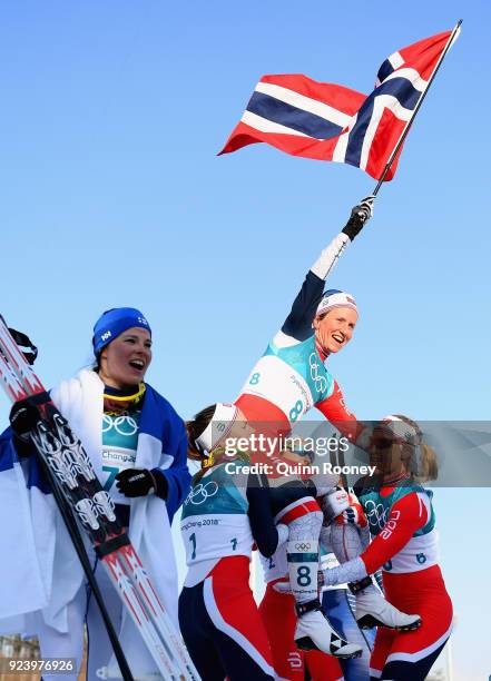 Marit Bjoergen of Norway celebrates winning the Ladies' 30km Mass Start Classic on day sixteen of the PyeongChang 2018 Winter Olympic Games at...