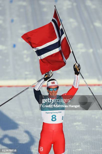 Marit Bjoergen of Norway celebrates winning the Ladies' 30km Mass Start Classic on day sixteen of the PyeongChang 2018 Winter Olympic Games at...