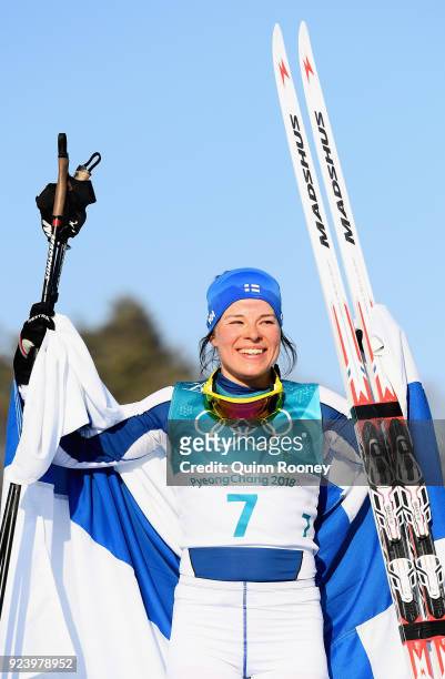 Krista Parmakoski of Finland celebrates finishing second during the Ladies' 30km Mass Start Classic on day sixteen of the PyeongChang 2018 Winter...