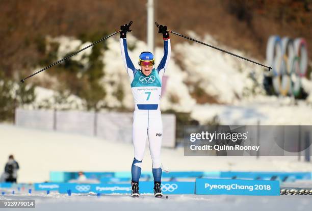 Krista Parmakoski of Finland celebrates finishing second during the Ladies' 30km Mass Start Classic on day sixteen of the PyeongChang 2018 Winter...