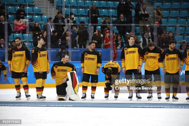 Silver medal winners Germany react during the medal ceremony after being defeated by Olympic Athletes from Russia 4-3 in overtime in the Men's Gold...