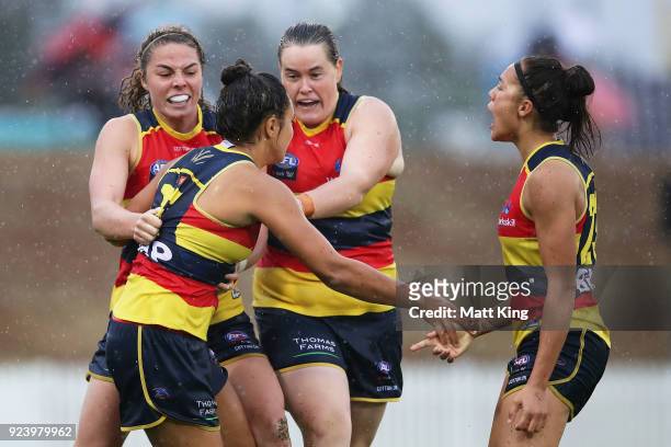 Ruth Wallace of the Crows celebrates with team mates after kicking a goal during the round four AFLW match between the Greater Western Sydney Giants...