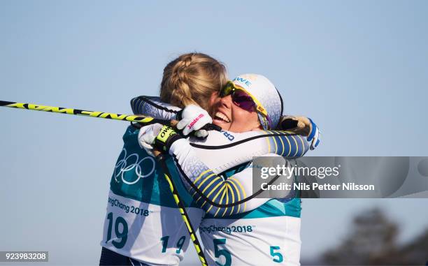 Stina Nilsson of Sweden reacts over the bronze medal together with Charlotte Kalla of Sweden during womens 30k Mass Start Classic Technique at...