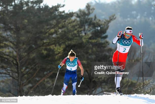 Ingvild Flugstad Oestberg of Norway and Jessica Diggins of the United States compete during the Ladies' 30km Mass Start Classic on day sixteen of the...