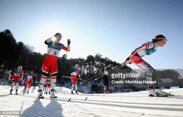 Teresa Stadlober of Austria and Marit Bjoergen of Norway compete during the Ladies' 30km Mass Start Classic on day sixteen of the PyeongChang 2018...