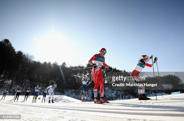 Ingvild Flugstad Oestberg of Norway and Heidi Weng of Norway compete during the Ladies' 30km Mass Start Classic on day sixteen of the PyeongChang...