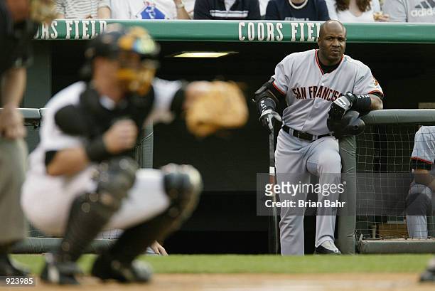 Barry Bonds of the San Francisco Giants watches the pitches to catcher Gary Bennett of the Colorado Rockies in the first inning at Coors Field in...