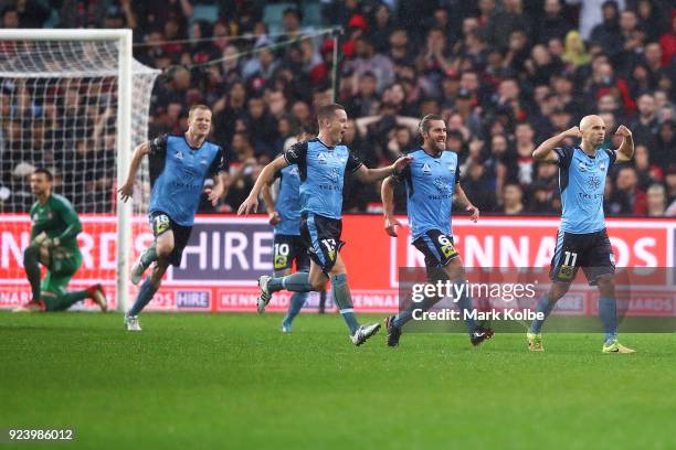 Sydney FC players runs to congratulate Adrian Mierzejewski of Sydney FC as he celebrates scoring a goal during the round 21 A-League match between...