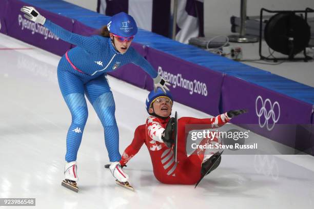 Pyeongchang- FEBRUARY 24 - Luiza Zlotkowska of Poland wipes out reaching for the finish line in the Ladies' Mass Start Semifinal in the PyeongChang...