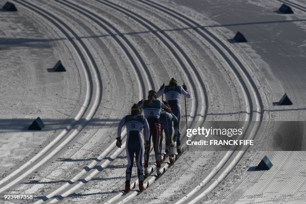 Athletes compete during the women's 30km cross country mass start classic at the Alpensia cross country ski centre during the Pyeongchang 2018 Winter...