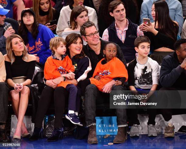 Mariska Hargitay and Peter Hermann sit courtside with children Amaya Hermann, Andrew Hermann and August Hermann at the New York Knicks vs Boston...