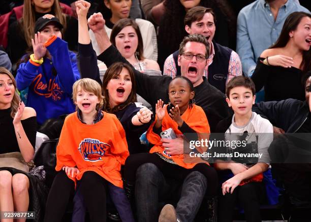 Mariska Hargitay and Peter Hermann sit courtside with children Amaya Hermann, Andrew Hermann and August Hermann at the New York Knicks vs Boston...