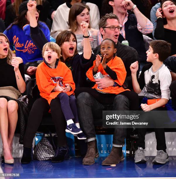 Mariska Hargitay and Peter Hermann sit courtside with children Amaya Hermann, Andrew Hermann and August Hermann at the New York Knicks vs Boston...