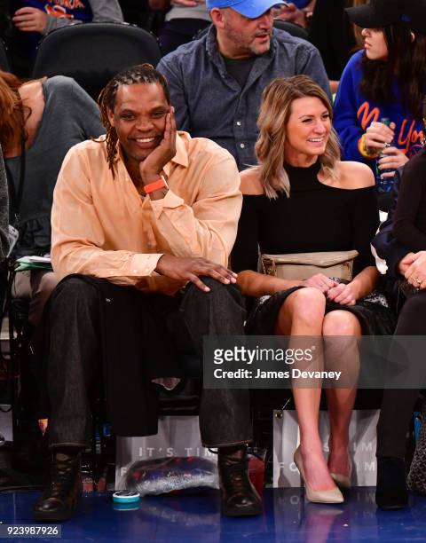 Latrell Sprewell and guest attend the New York Knicks vs Boston Celtics game at Madison Square Garden on February 24, 2018 in New York City.