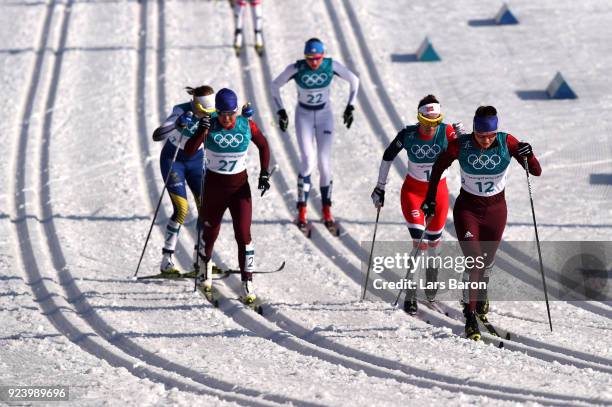 Anastasia Sedova of Olympic Athlete from Russia leads the group during the Ladies' 30km Mass Start Classic on day sixteen of the PyeongChang 2018...