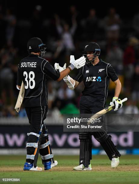 Black Caps batsmen Tim Southee and Mitchell Santner celebrate last over victory during the 1st ODI between New Zealand and England at Seddon Park on...
