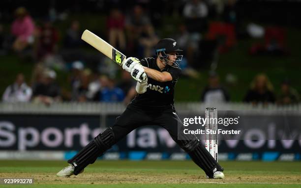 New Zealand batsman Mitchell Santner hits out during the 1st ODI between New Zealand and England at Seddon Park on February 25, 2018 in Hamilton, New...