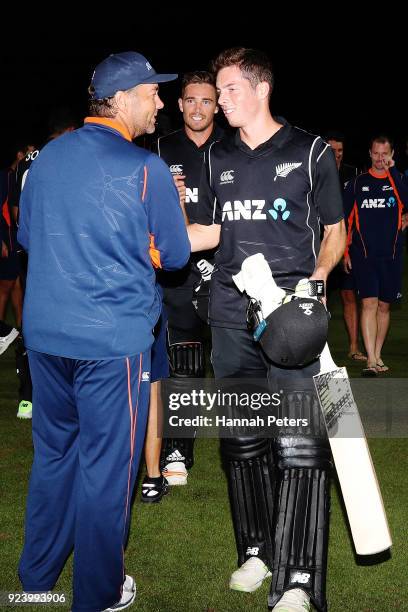 Mitchell Santner of the Black Caps is congratulated by batting coach Craig McMillian after winning game one in the One Day International series...