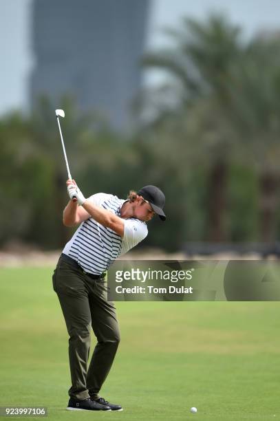 Eddie Pepperell of England hits an approach shot on the 15th hole during the final round of the Commercial Bank Qatar Masters at Doha Golf Club on...