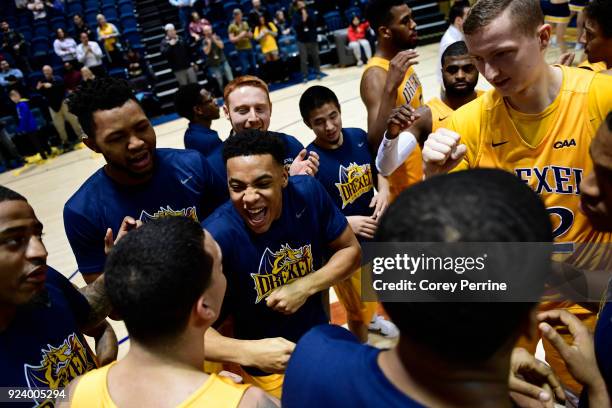 Kris Alford of the Drexel Dragons celebrates with teammates after the win against the Delaware Fightin Blue Hens at the Daskalakis Athletic Center on...