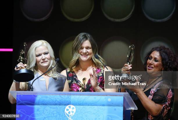 Vanessa Dionne, Cassie Russek and Rheanne Garcia accept an award onstage during the 2018 Make-Up Artists and Hair Stylists Guild Awards held at The...