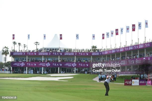 Eddie Pepperell of England hits an approach shot on the 18th hole during the final round of the Commercial Bank Qatar Masters at Doha Golf Club on...