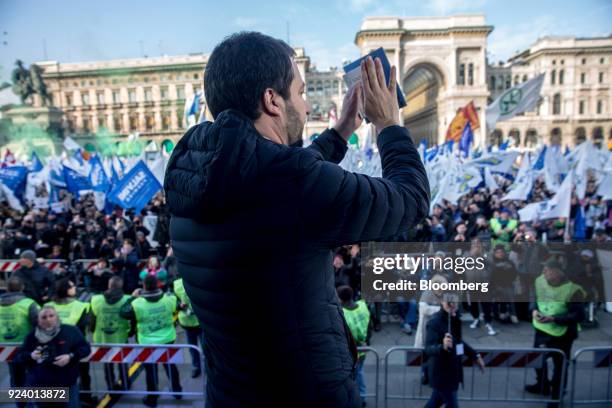 Matteo Salvini, leader of the euroskeptic party League, holds a bible as he speaks during an election campaign rally at Duomo Square in Milan, Italy,...