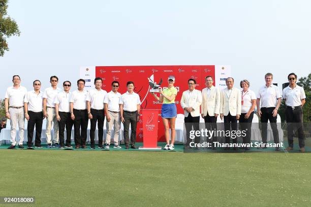 Jessica Korda of United States poses with the trophy and sponsorship on the 18th green after winning the Honda LPGA Thailand at Siam Country Club on...