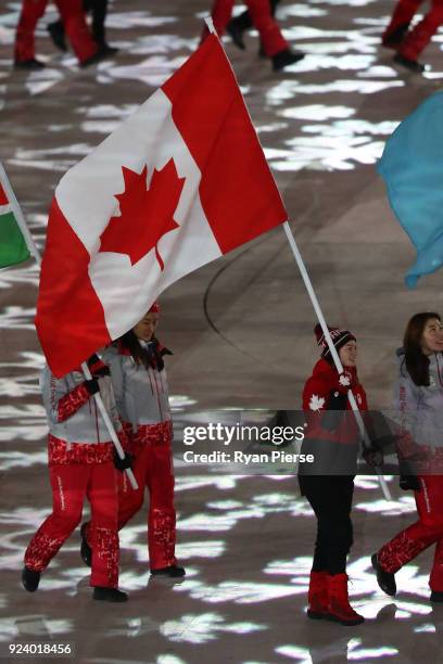 Flag bearer Kim Boutin of Canada walks in the Parade of Athletes during the Closing Ceremony of the PyeongChang 2018 Winter Olympic Games at...