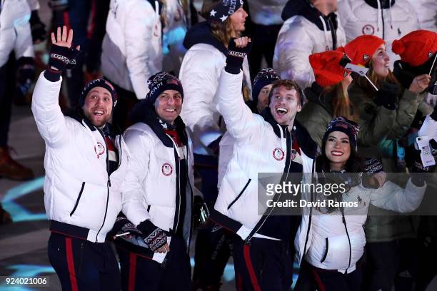 Madison Chock and Evan Bates walk with Team USA in the Parade of Athletes during the Closing Ceremony of the PyeongChang 2018 Winter Olympic Games at...