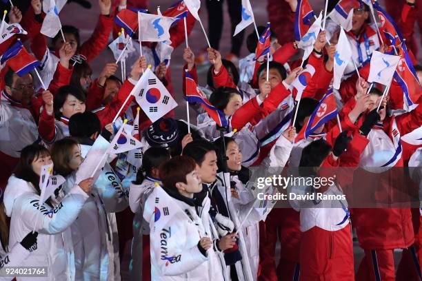Team Korea and Team Republic of Korea walk in the Parade of Athletes during the Closing Ceremony of the PyeongChang 2018 Winter Olympic Games at...