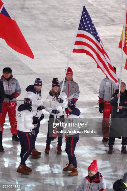 Flag bearer Jessica Diggins of the United States walks in the Parade of Athletes during the Closing Ceremony of the PyeongChang 2018 Winter Olympic...