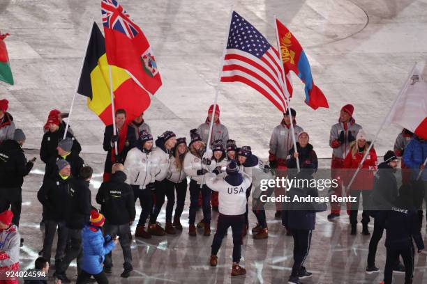 Flag bearer Jessica Diggins of the United States walks in the Parade of Athletes during the Closing Ceremony of the PyeongChang 2018 Winter Olympic...