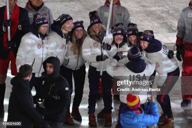 Flag bearer Jessica Diggins of the United States with Team USA participates in the Parade of Athletes during the Closing Ceremony of the PyeongChang...