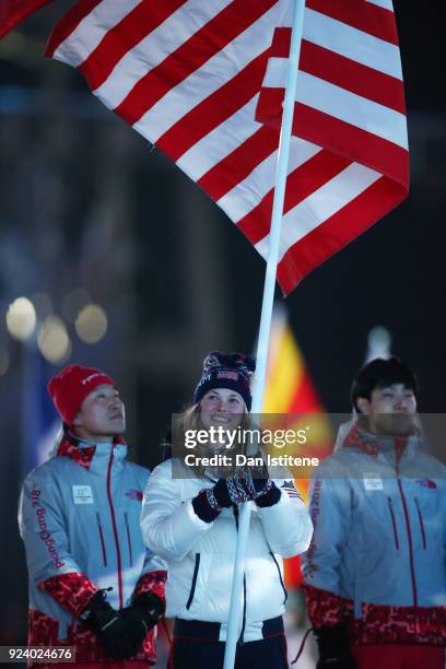 Flag bearer Jessica Diggins of the United States participates in the Parade of Athletes during the Closing Ceremony of the PyeongChang 2018 Winter...
