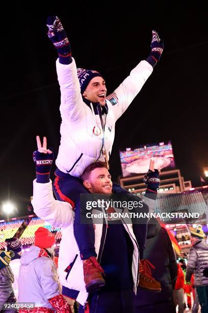 Athletes Adam Rippon and Gus Kenworthy parade with other delegations during the closing ceremony of the Pyeongchang 2018 Winter Olympic Games at the...