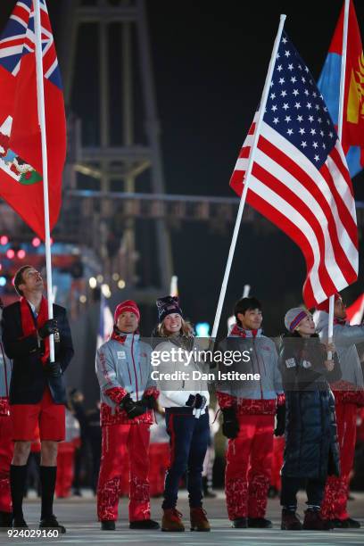 Flag bearer Jessica Diggins of the United States participates in the Parade of Athletes during the Closing Ceremony of the PyeongChang 2018 Winter...