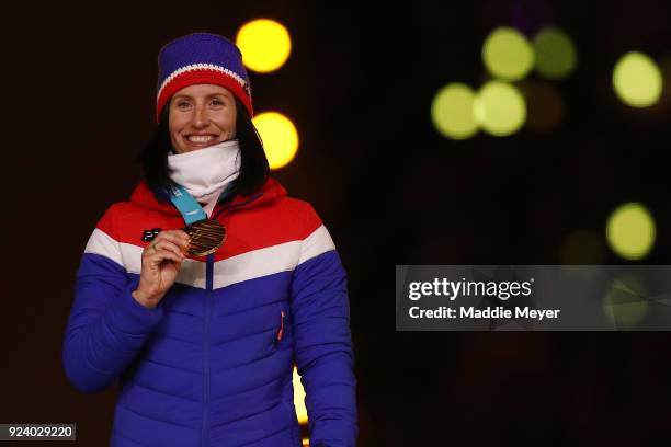 Gold medalist Marit Bjorgen of Norway poses during the medal ceremony for the Cross-Country Skiing - Ladies' 30km Mass Start Classic during the...
