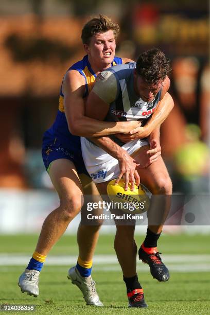 Brayden Ainsworth of the Eagles tackles Brad Ebert of the Power during the JLT Community Series AFL match between the West Coast Eagles and the Port...