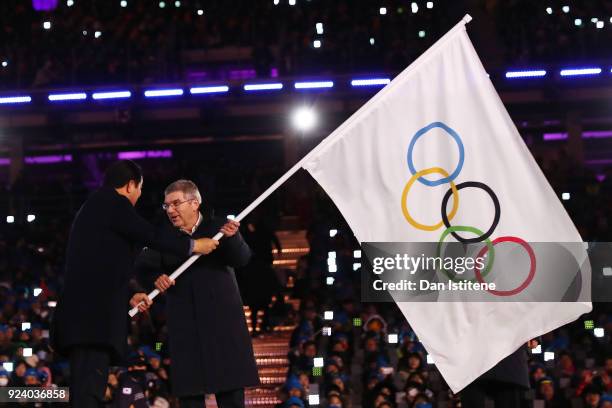 Mayor of PyeongChang Sim Jae-guk and President of the International Olympic Committee Thomas Bach participate in the Olympic flag handover ceremony...